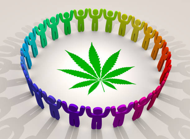 a group of people holding hands in a circle with a leaf